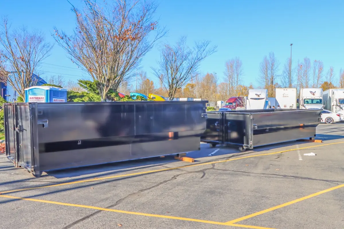 Professional dumpster rental service with roll-off container on residential driveway in Gahanna